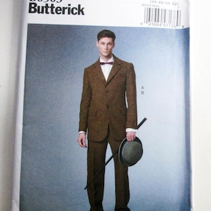May include: A Butterick B6503 sewing pattern envelope featuring a brown tweed suit with a white shirt and a dark bow tie. The model holds a black cane and a grey bowler hat. The text includes B6503, Butterick, MQQ, 46-48-50-52, and Making History.