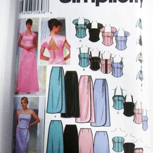 May include: A Simplicity sewing pattern featuring illustrations of formal dresses, tops, and skirts. The pattern includes various styles in pink, blue, and black. The package has the number 5953 and the Simplicity logo.