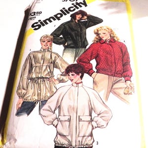 May include: A Simplicity 5707 sewing pattern envelope featuring illustrations of four different jacket styles. The designs include a black jacket, a red quilted jacket, a beige jacket with a drawstring waist, and a white jacket with front pockets.