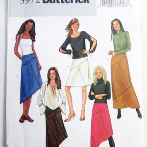 May include: Butterick sewing pattern 3972 featuring illustrations of five different skirt and top combinations. The designs include various lengths, colors, and textures, such as a blue denim skirt, a plaid skirt, a pink skirt, and a long brown skirt.