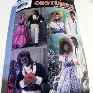 May include: A Simplicity Costumes sewing pattern envelope, number 7971, size A for adults. The packaging features photographs of various costumes, including a pink gown, a dark blue tailcoat, a white suit, and a blue and white floral dress.