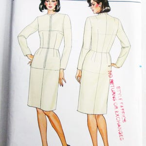 May include: Butterick sewing pattern 3415, size 22, featuring a white dress with long sleeves, a high neckline, and a front zipper closure. The illustration shows both front and back views of the garment on a white background with red text.