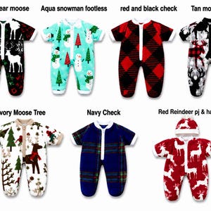 May include: A collection of seven infant footed sleepers featuring various holiday patterns including black bear and moose, aqua snowman, red and black check, tan moose, ivory moose and tree, navy check, and a red reindeer sleeper with a matching hat.