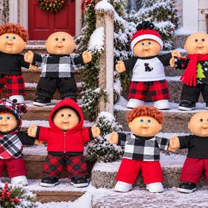 May include: Eight Cabbage Patch Kids dolls with round faces and various expressions, dressed in winter-themed outfits including plaid pants, hoodies, and sweaters, standing on snow-covered wooden steps with a sign reading Let it Snow.