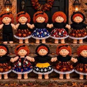 May include: Ten dolls with orange yarn hair and light skin tones, each wearing black tops and various Halloween-themed skirts or pants with pumpkin, ghost, and skull patterns. The dolls are arranged in two rows on stone steps with festive decor.