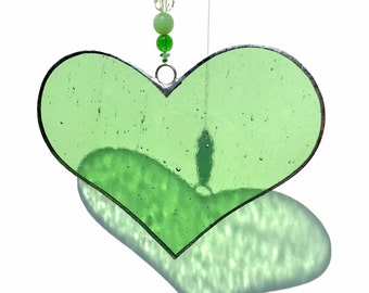 Green stained glass heart sun catcher.