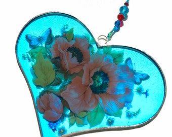 Blue stained glass heart sun catcher with poppies, forget me nots and butterflies.