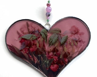 Pink stained glass heart sun catcher with irises, fuchsias and butterfly.