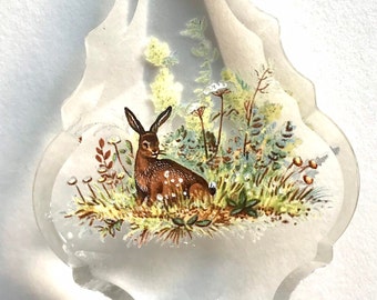 Hare sun catcher with wildflowers.