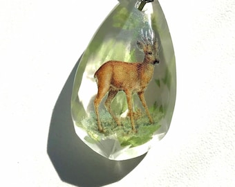 Deer sun catcher with leaves.