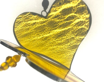 Yellow stained glass heart sun catcher.