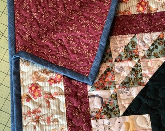 Nostalgic Looking Quilt, that begs to be cuddled in - Warm multi colors of blue, brown, burgundy.