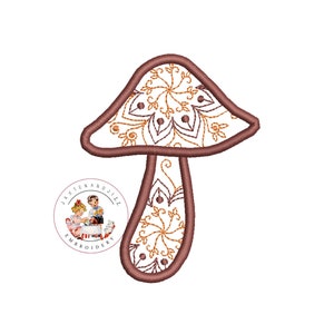 May include: A brown mushroom with a white and gold mandala design. The mushroom is embroidered with a detailed pattern.