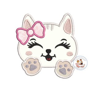 May include: White cat with pink bow and closed eyes, smiling with its tongue sticking out. The cat has gray paw prints on its front paws.
