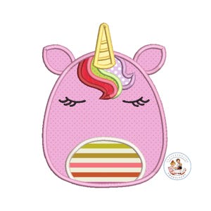 May include: Pink and white unicorn applique with a rainbow mane and a yellow horn. The unicorn has closed eyes and a striped bottom.