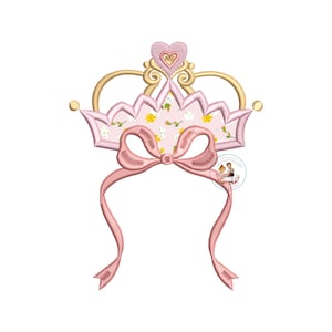 May include: A pink and gold crown with a floral pattern and a pink bow. The crown is designed for embroidery.