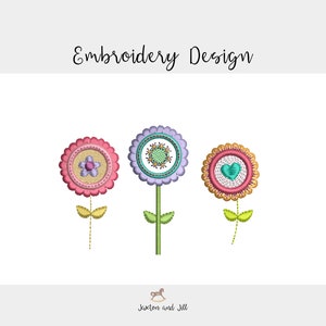 May include: Three embroidered flower designs with different colored centers and stems. The flowers are pink, purple, and red with yellow, green, and blue accents.
