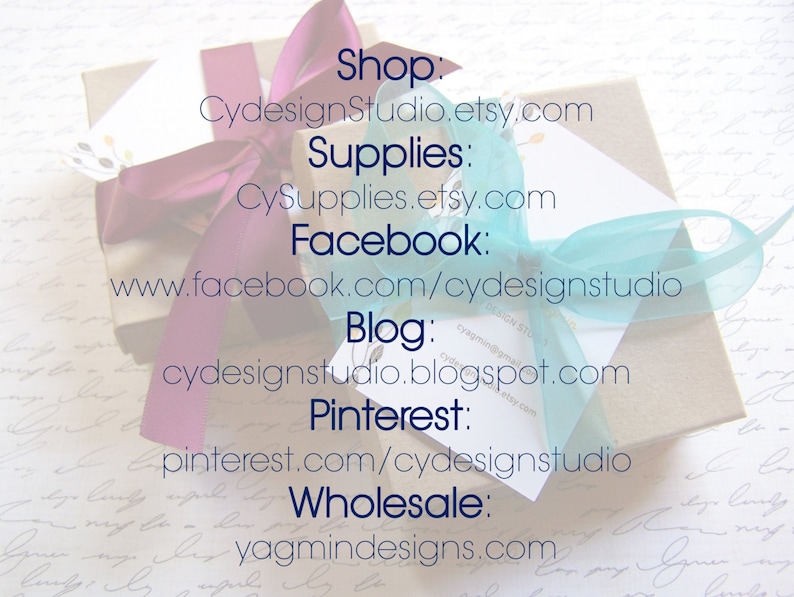 May include: A gift box wrapped in beige paper, adorned with a purple ribbon and a light blue ribbon. The image includes text with shop and social media information, including Etsy and Facebook URLs.