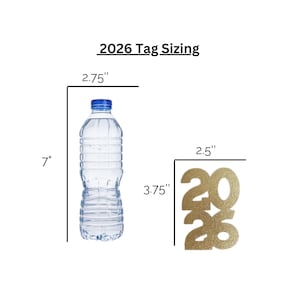 May include: A clear plastic water bottle with a blue cap, measuring 7 inches tall and 2.75 inches wide. Next to it is a gold glitter tag with the year 2026, 3.75 inches tall and 2.5 inches wide. Text above reads "2026 Tag Sizing."
