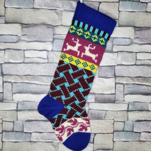 May include: A colorful knitted Christmas stocking with a blue cuff, a burgundy and turquoise diamond pattern, and a pink and yellow reindeer pattern.