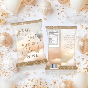 May include: A pair of chip bags with a gold glitter design. The front of the bag says "Miffi & Josh Are On Cloud Nine". The back of the bag has a nutrition facts label and says "Thank you for making us feel like we're floating on Cloud 9!"