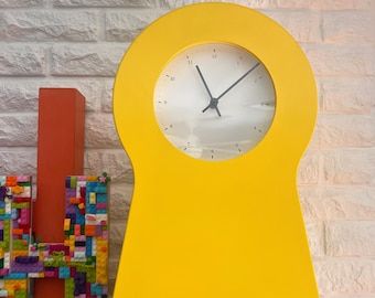 vintage Ikea PS 1995 wall clock in bright yellow fun keyhole design