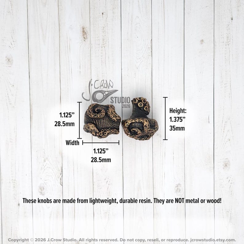 The knobs are 1.125 inches wide and 1.375 inches tall.