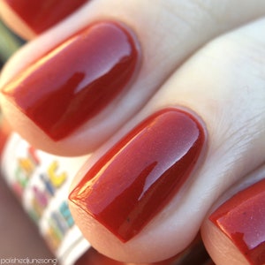 Blood Oath Nail Polish - true red creme with flecks of black & grey