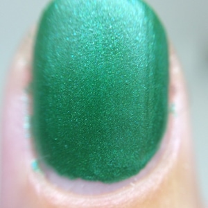 Against All Logic Nail Polish matte green with blue sparkle image 3