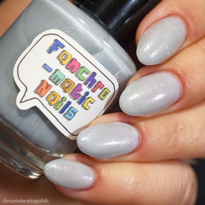 Each Runic Letter Nail Polish - light periwinkle jelly with blue iridescent flakes