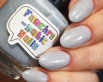 Each Runic Letter Nail Polish - light periwinkle jelly with blue iridescent flakes