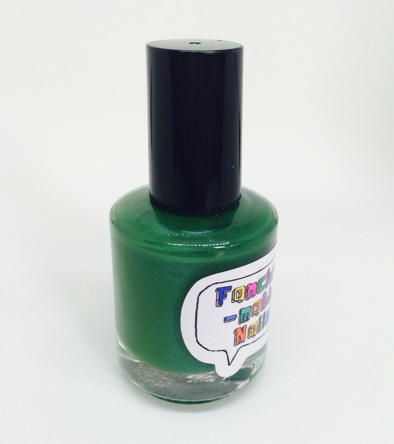 Against All Logic Nail Polish matte green with blue sparkle image 5