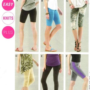 May include: McCall's sewing pattern envelope featuring six variations of knit shorts and leggings labelled A through F. The designs include solid black, blue, and tan colours, a distressed print, and a grey pair with a purple side stripe detail.