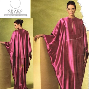 May include: A sewing pattern envelope for a Chado Ralph Rucci Vogue Patterns design, labeled V1181. The cover features a magenta satin kaftan-style dress with a keyhole neckline and wide sleeves, shown from both front and back perspectives.