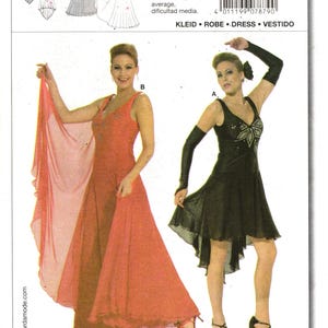 May include: A Burda 7879 sewing pattern envelope featuring two dress designs. Design A is a short black dress with a star-like chest embellishment and long gloves. Design B is a long, flowing coral dress with a sheer wrap. Includes size charts.