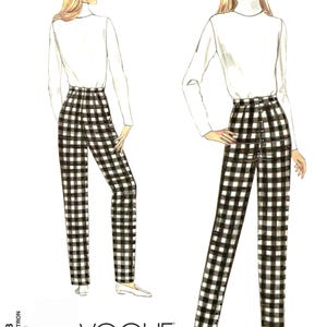 May include: A sewing pattern envelope for Vogue Patterns 1003 featuring a fashion illustration of a person wearing a white long-sleeve turtleneck top and high-waisted black and white chequered trousers shown from both the front and back views.