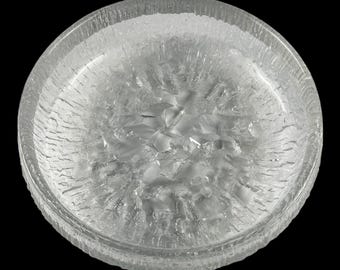 May include: A clear, round glass bowl with a textured, ice-like appearance. The bowl has a thick rim and a rough, uneven surface, creating a unique, artistic aesthetic. The interior features a fractured, crystalline design. The bowl is set against a black background.