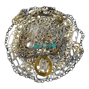 May include: A large pile of gold and silver chains, some with turquoise beads, in a tangled heap.
