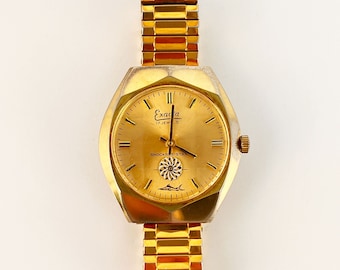 Reloj mecánico vintage Exacta para hombre, tono dorado, segundero tipo caleidoscopio, 17 rubíes.
