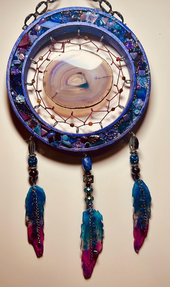 Agate Dreamcatcher woven in a wood ring of found objects and glass feathers.