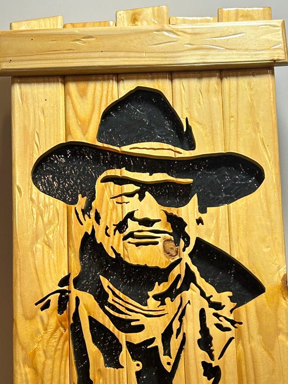 John Wayne "Rooster Cogburn" silhouette on panelboard.