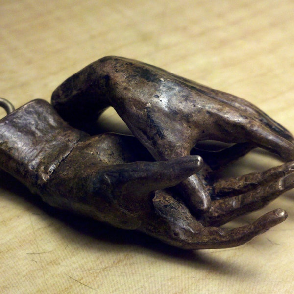 Bronze sculpture 2" long small bronze hands with bronze screw eyes,