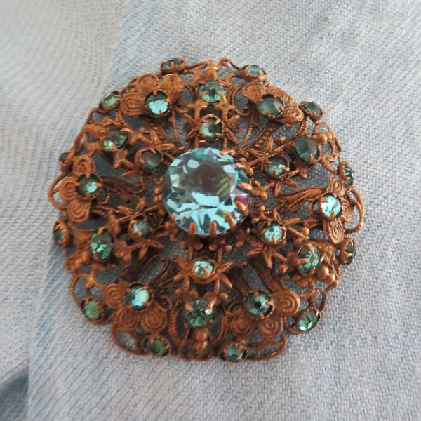 Vintage Czechoslovakian Large Round Ornate Gold Tone Brooch/Pin set with Turquoise/Teal Glass Gems - 1910's