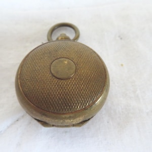 Antique Brass Watch Style Sovereign/Coin Case/Holder with Engine Turned Case & Gilded Interior