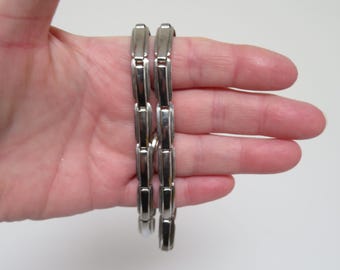 Brazaletes/ligas expandibles de eslabones planos en tono dorado vintage - Patente de la década de 1930