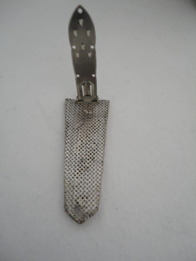 May include: A silver metal watch band with a mesh design and a clasp that folds up.
