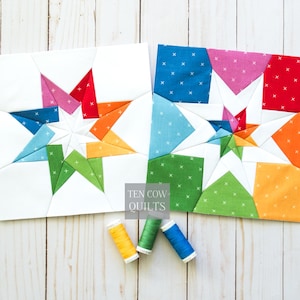 Puede incluir: Dos bloques de edredón de estrella coloridos con fondos blancos. Las estrellas presentan tonos vibrantes de rojo, naranja, rosa, verde y azul. El texto "TEN COW QUILTS" es visible. También hay tres carretes de hilo en amarillo, verde y azul.