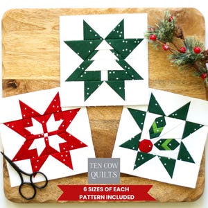May include: Three square quilt blocks featuring holiday designs. One block shows a white tree on a dark green star background, one a red star with white accents, and one a green star with holly berries. Text reads TEN COW QUILTS 6 SIZES OF PATTERN INCLUDED.