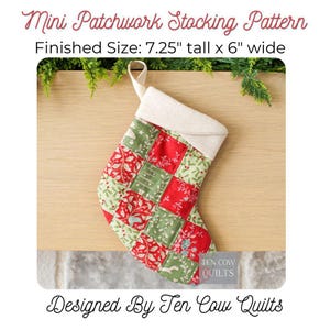 May include: A mini patchwork Christmas stocking with a cream cuff and hanging loop. The stocking is made of red and green patchwork squares with floral and holiday patterns. Finished size is 18.4 cm tall by 15.2 cm wide. Designed by Ten Cow Quilts.