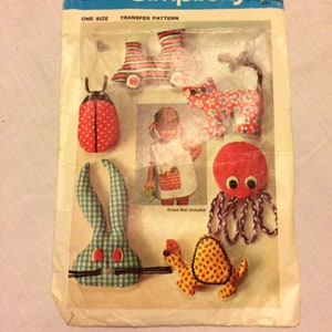 May include: Vintage Simplicity pattern 8531 featuring fabric toy designs. The pattern includes instructions for a ladybug, bunny, turtle, octopus, cat, and roller skates. The pattern is one size and includes a transfer pattern.